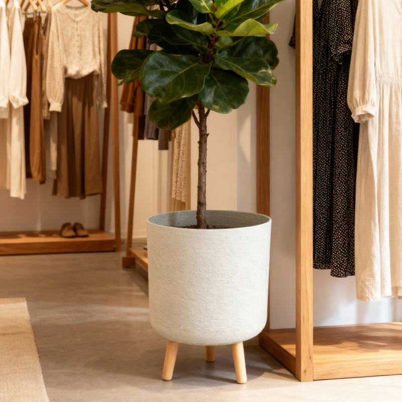 Jardinera cilíndrica versátil tipo yeso con patas de madera